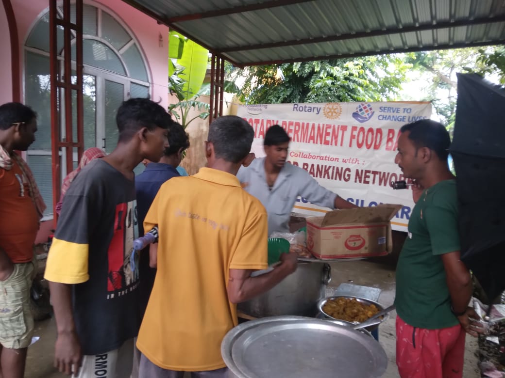 Distribution of cooked foods from permanent food bank.