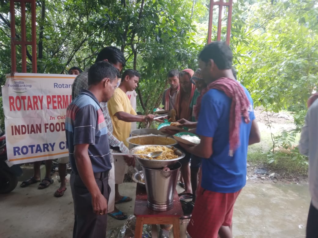 Distribution of cooked food from permanent food bank.