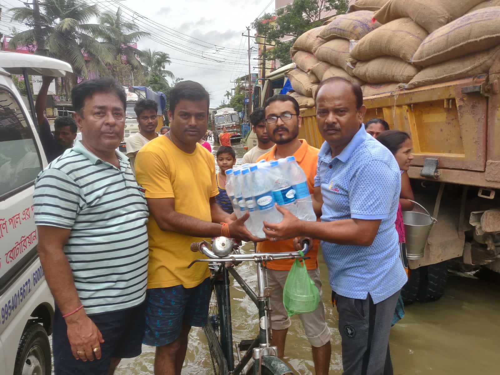 Distribution of water bottle to flood victims at Silchar Town.