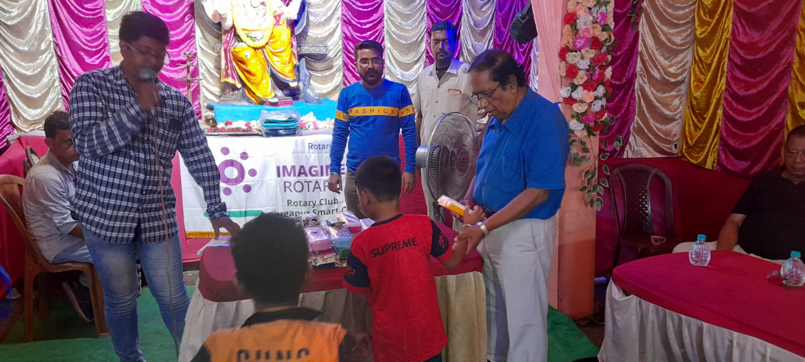 Cloths distribution to the needy during Ganesh Puja Inauguration